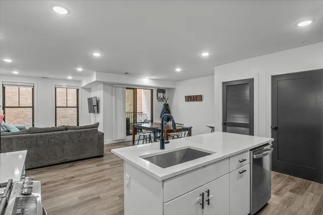 a kitchen with a sink and cabinets