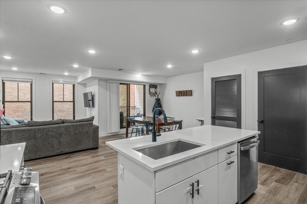 173 Magnolia Street, Unit 5 Boston, MA 02125 - Photo 6 of 23 a kitchen with a sink and cabinets