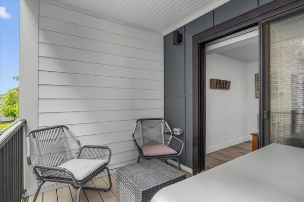 a bedroom with a bed and chair