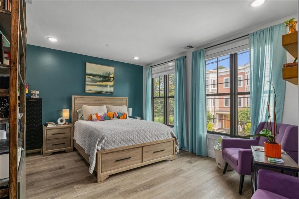 173 Magnolia Street, Unit 5 Boston, MA 02125 - Photo 10 of 23 a bedroom with a large bed and a window