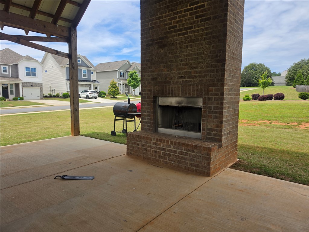 312 Phillips Drive Pendleton, SC 29670 - Photo 43 of 45 This community common grounds offers 2 charming brick fireplaces, 2 picnic tables, lights, and shade for perfect outdoor relaxation.