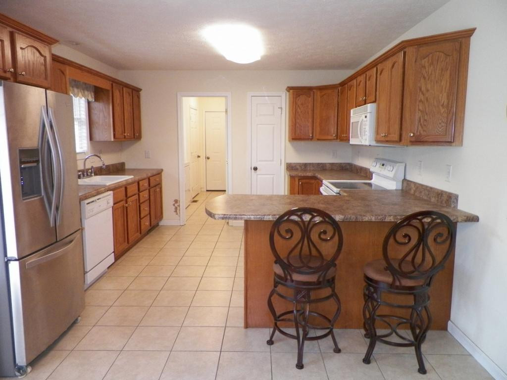 303 Reed Avenue Greeneville, TN 37743 - Photo 7 of 36 Kitchen into laundry garage