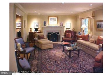 5816 Marbury Road Bethesda, MD 20817 - Photo 12 of 18 a living room with furniture and a fireplace