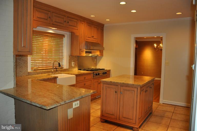 5816 Marbury Road Bethesda, MD 20817 - Photo 15 of 18 a kitchen that has a sink and a stove