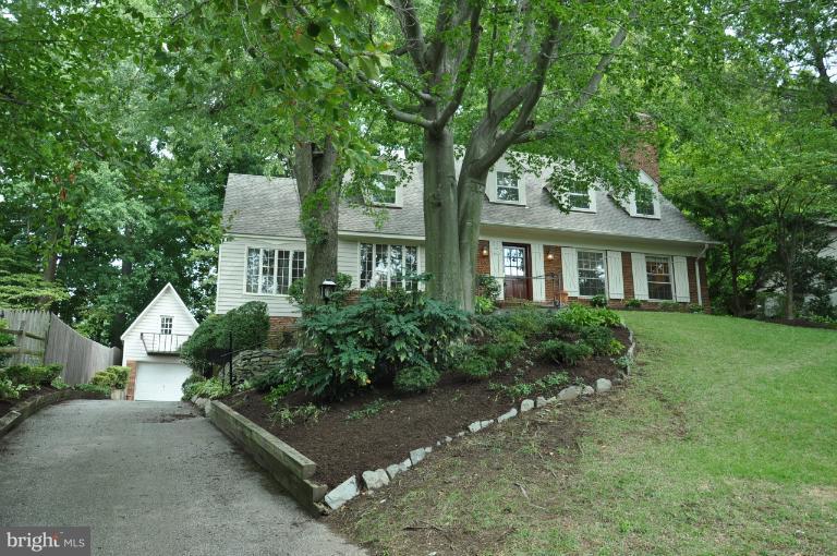 5816 Marbury Road Bethesda, MD 20817 - Photo 2 of 18 a front view of a house with a garden
