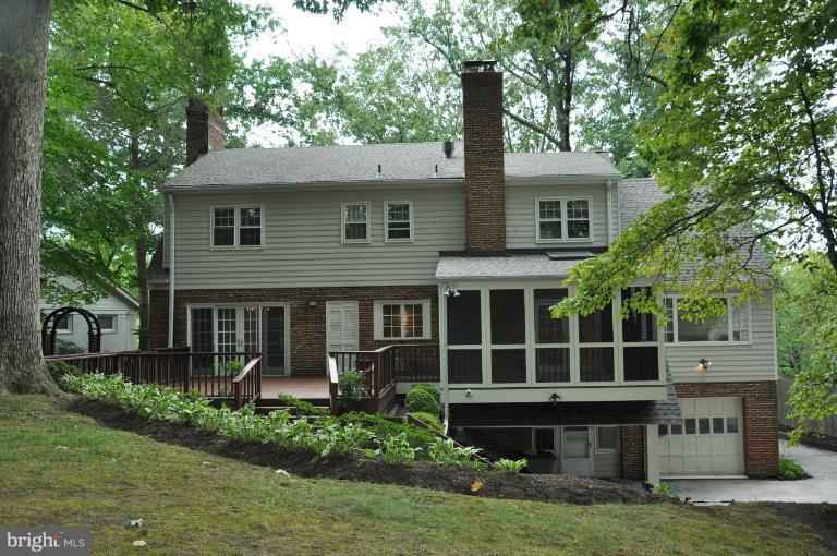 5816 Marbury Road Bethesda, MD 20817 - Photo 4 of 18 a front view of a house with a garden and plants