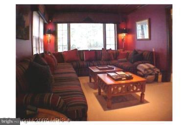 5816 Marbury Road Bethesda, MD 20817 - Photo 10 of 18 a living room with furniture and a window