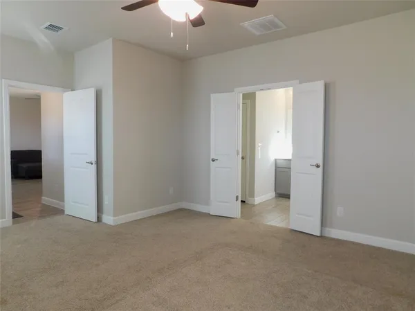 an empty room with a bathroom