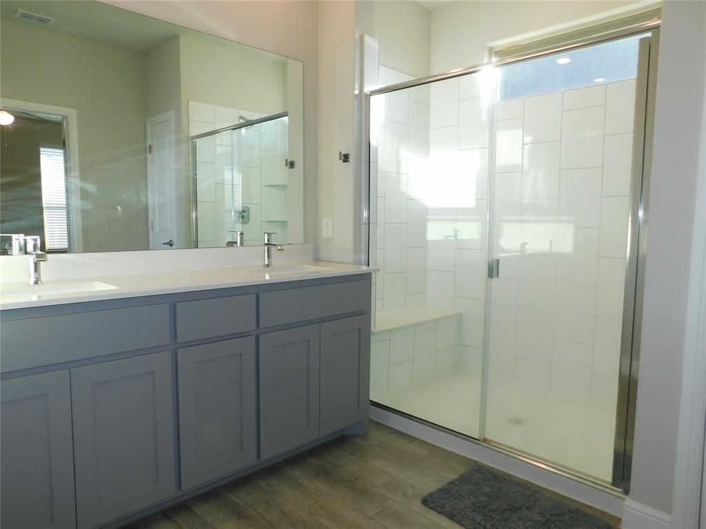 5230 Mountain View Drive Krum, TX 76249 - Photo 14 of 27 a bathroom with a shower sink and mirror