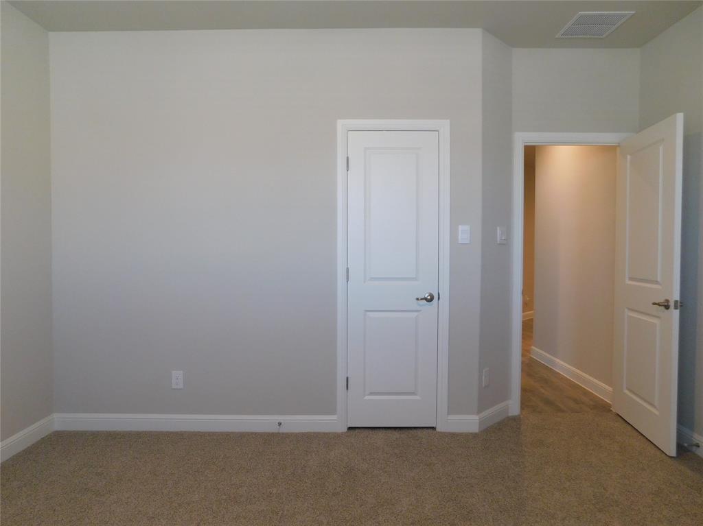 5230 Mountain View Drive Krum, TX 76249 - Photo 17 of 27 an empty room with closet area