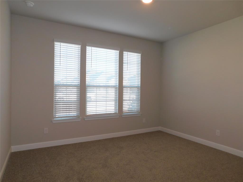 5230 Mountain View Drive Krum, TX 76249 - Photo 18 of 27 an empty room with a window
