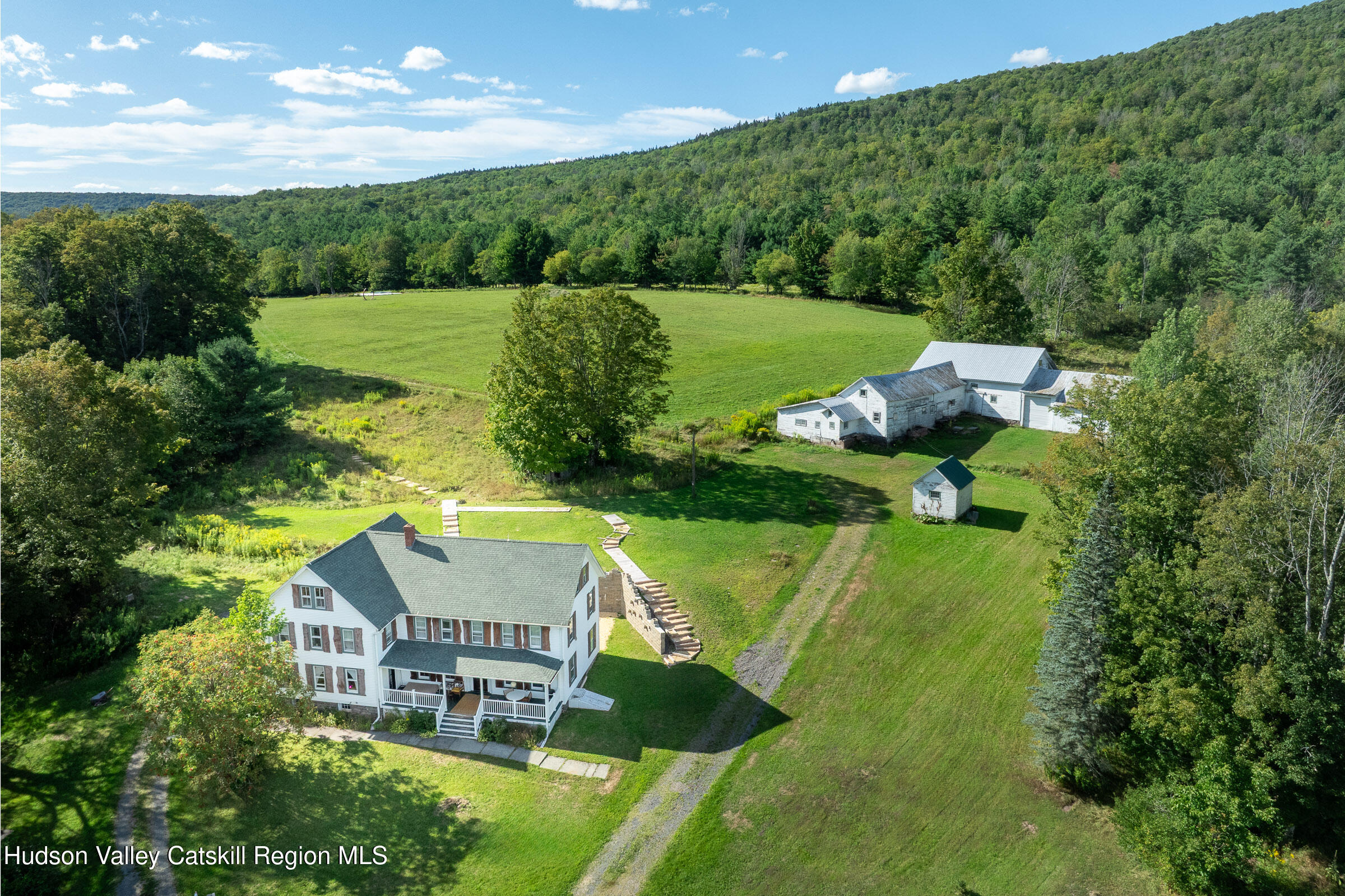 an aerial view of a house with a garden