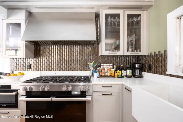 a kitchen with a stove and a cabinet