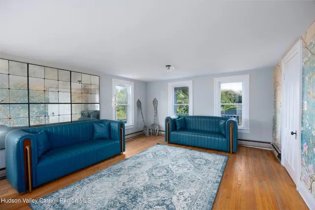 a living room with furniture and a rug