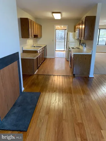 a view of balcony with wooden floor
