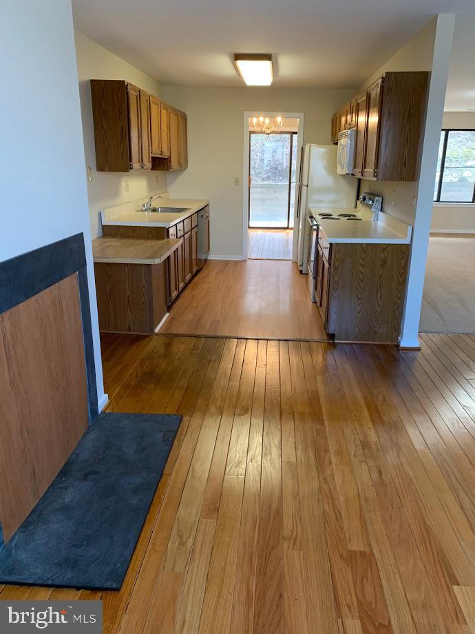 468 Lynetree Drive West Chester, PA 19380 - Photo 18 of 43 a kitchen with wooden floors and appliances