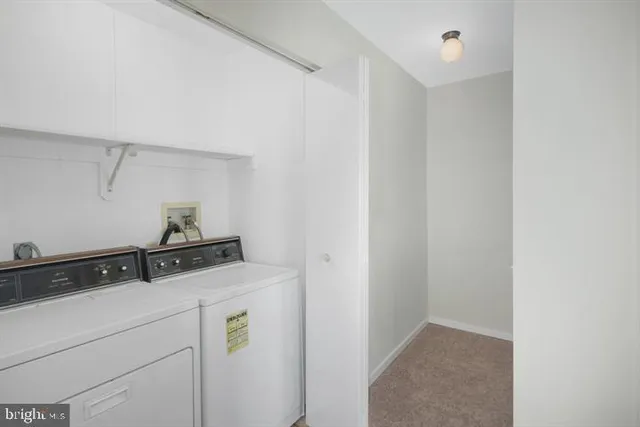 a view of an empty room with closet