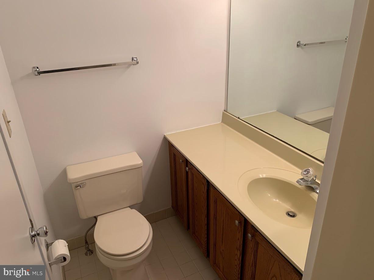 468 Lynetree Drive West Chester, PA 19380 - Photo 34 of 43 a bathroom with a granite countertop sink toilet and a mirror