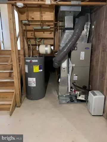 a living room with a fireplace and a floor to ceiling window