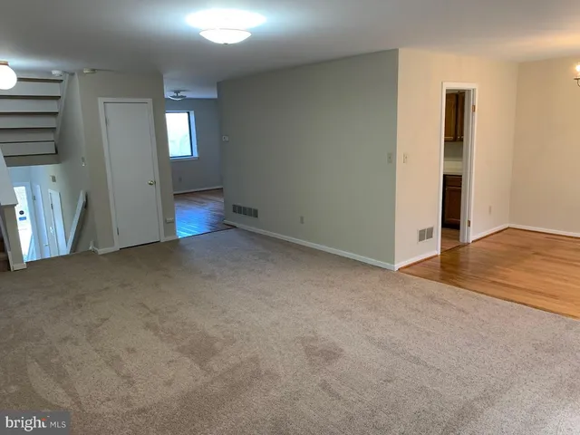 a view of a kitchen from the hallway