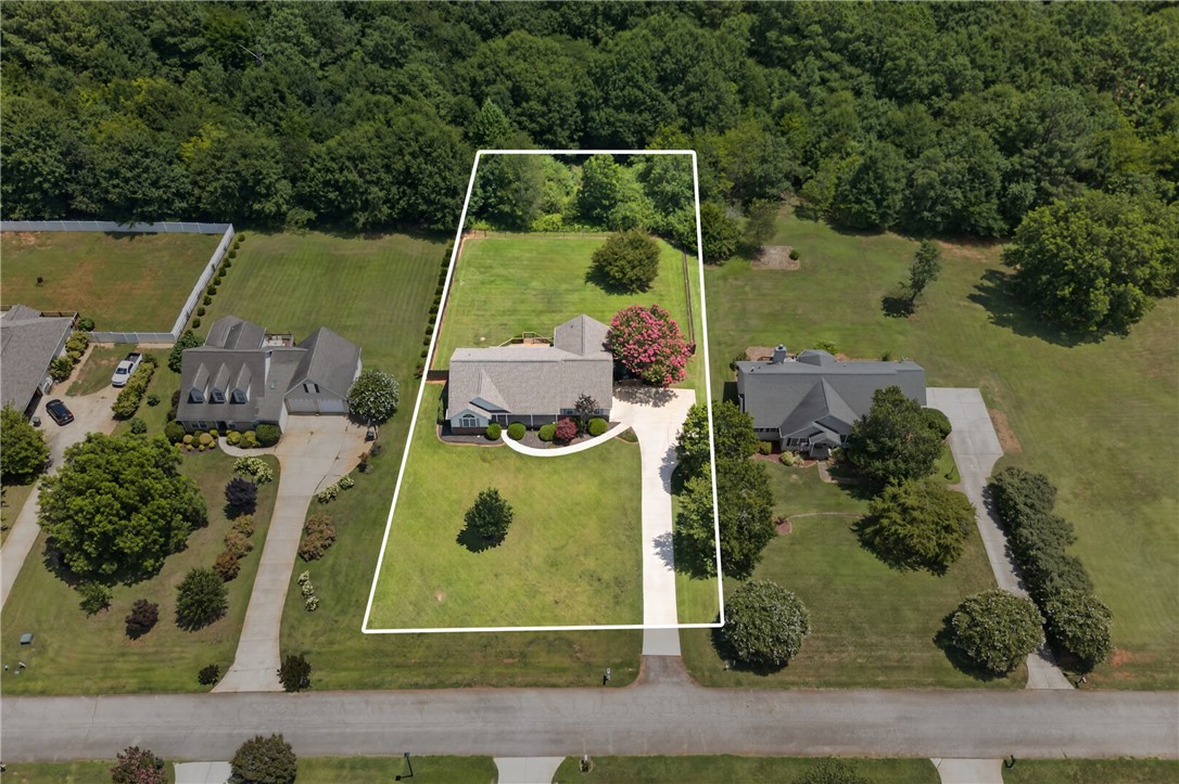 612 Providence Point Drive Seneca, SC 29678 - Photo 42 of 43 An aerial view showcases a meticulously maintained home on an expansive lot with a long, inviting driveway.