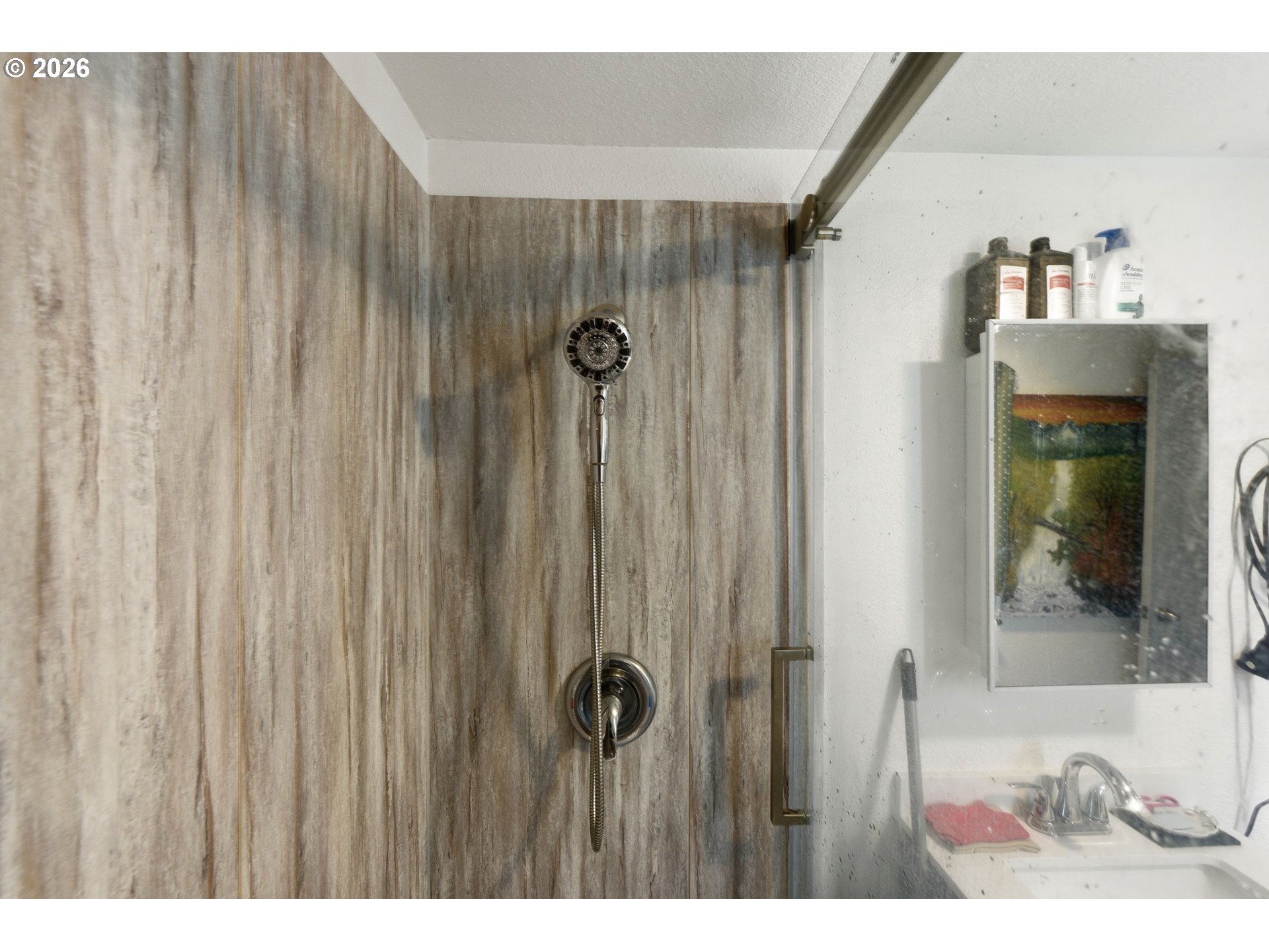 1955 Maple Street North Bend, OR 97459 - Photo 45 of 48 a bathroom with a shower and a sink