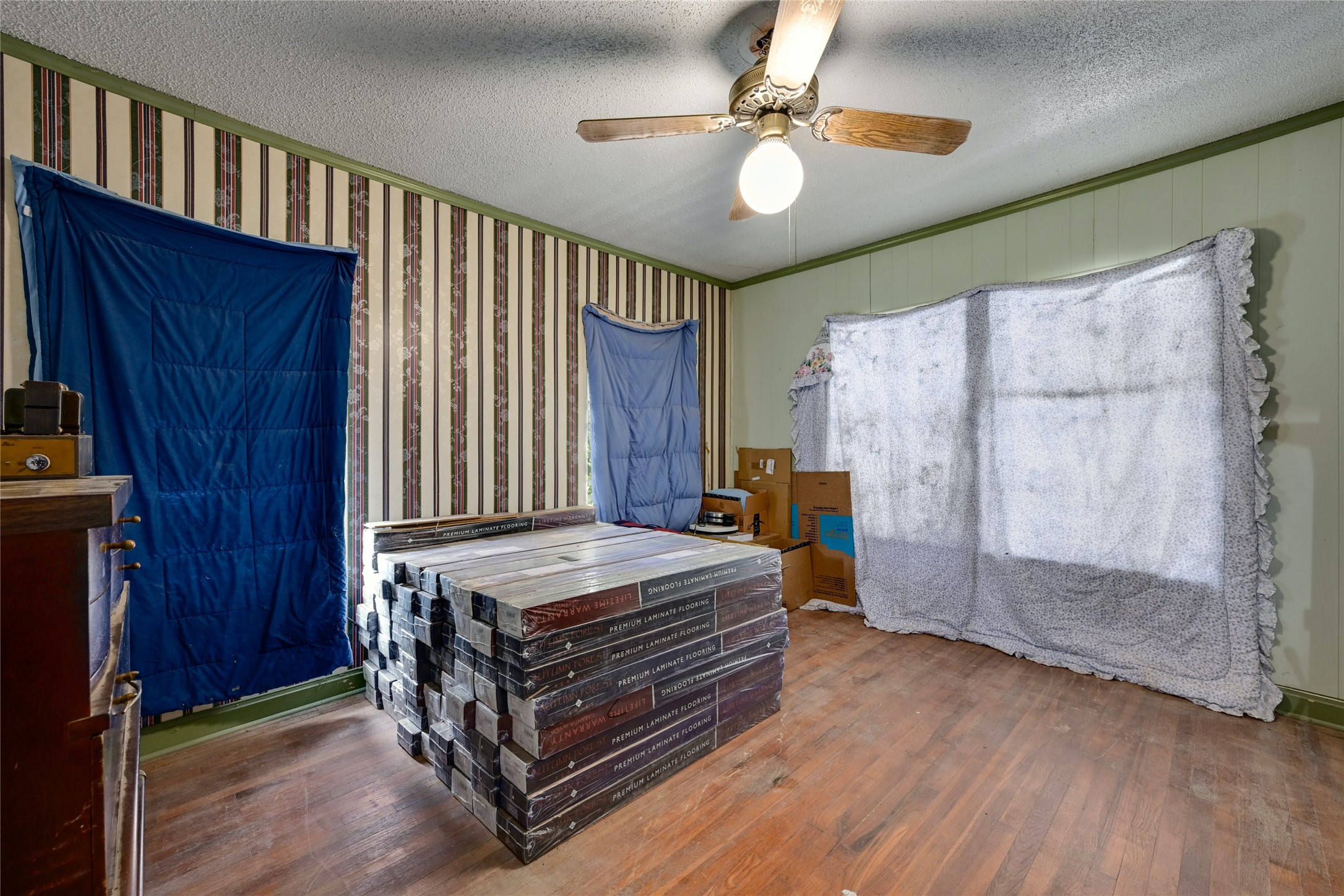 681 County Road 474 Elgin, TX 78621 - Photo 13 of 37 a bedroom with a bed and a chandelier
