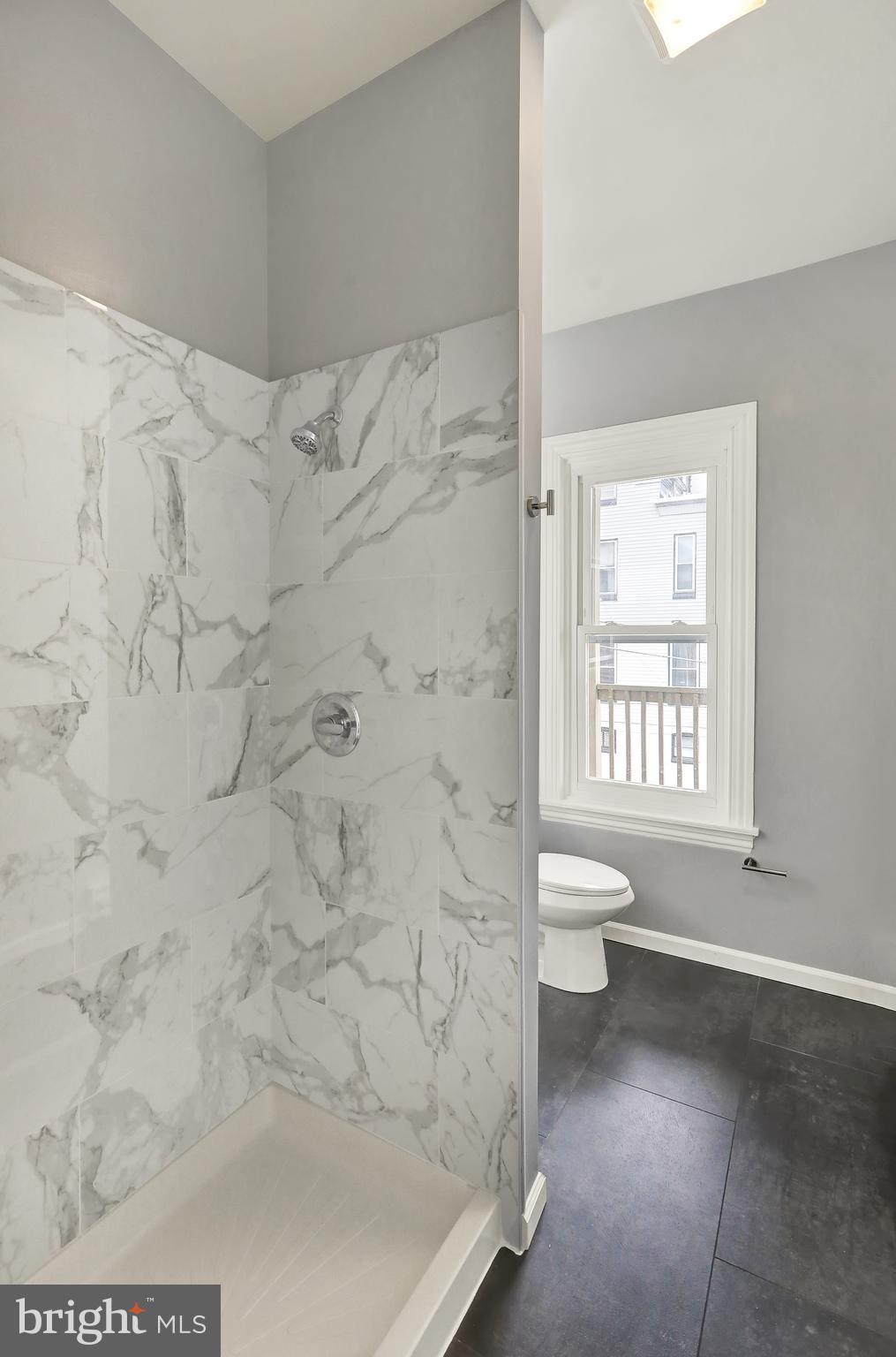 1156 Franklin Street, Unit 3 Reading, PA 19602 - Photo 6 of 11 a bathroom with a toilet and a shower
