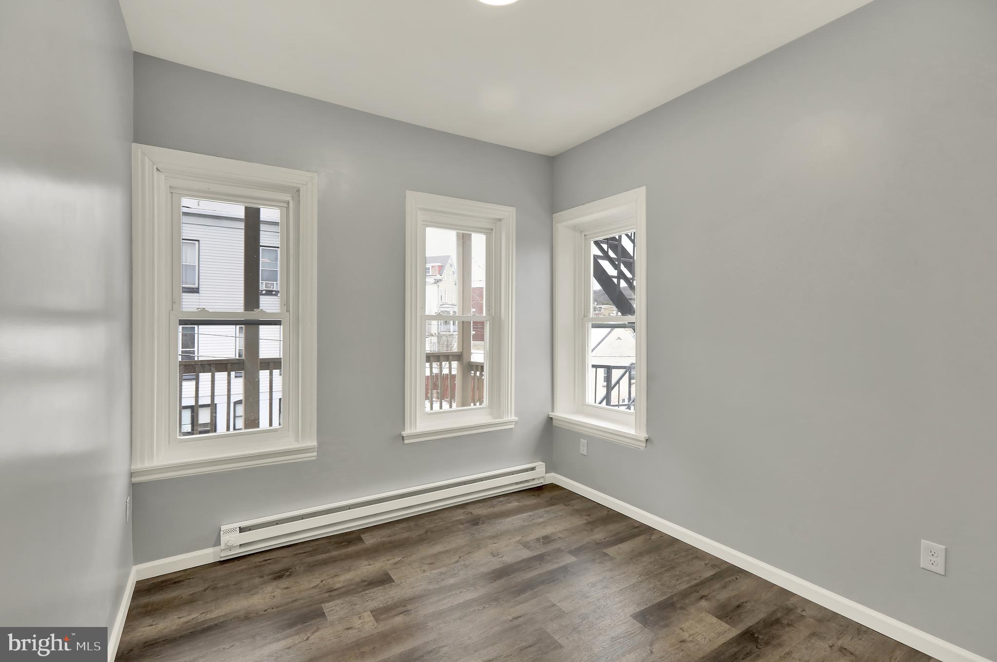 1156 Franklin Street, Unit 3 Reading, PA 19602 - Photo 7 of 11 an empty room with windows