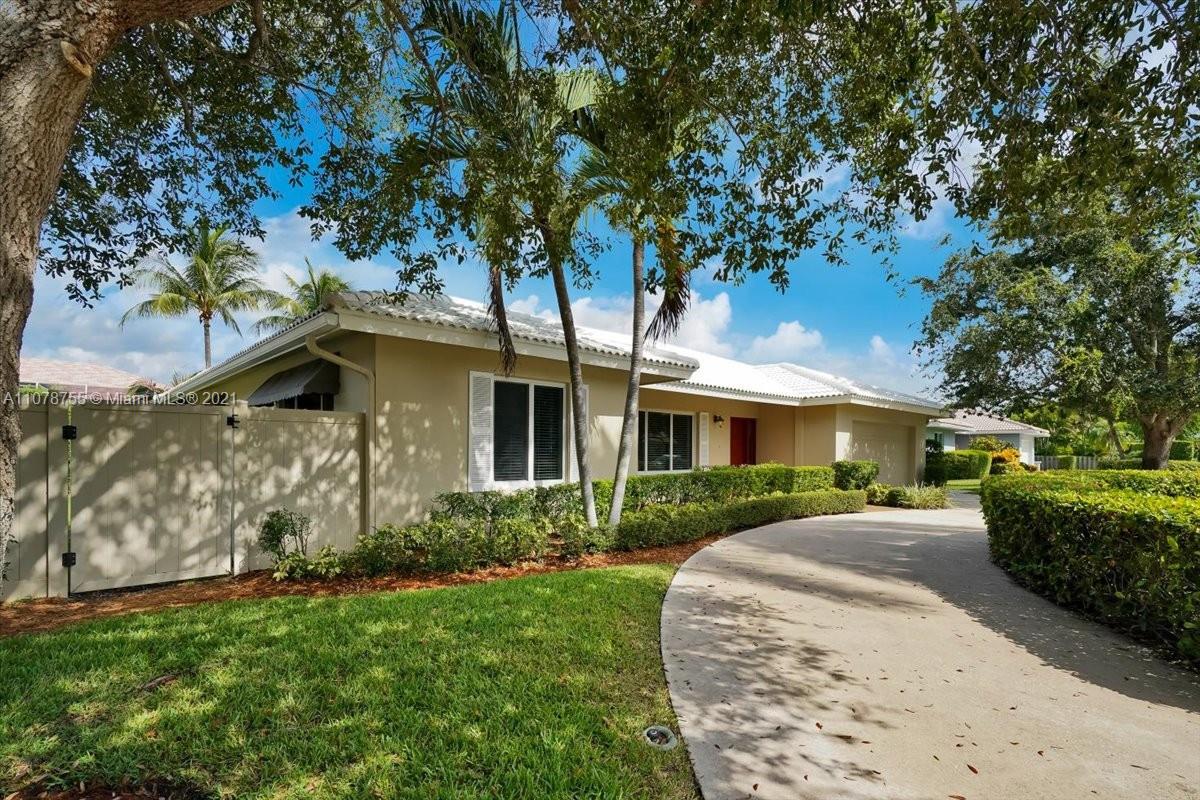 1525 Southwest 6th Avenue Boca Raton, FL 33486 - Photo 1 of 30 a front view of a house with a garden