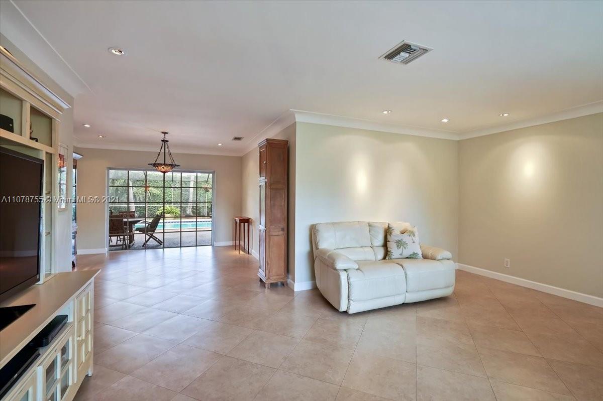 1525 Southwest 6th Avenue Boca Raton, FL 33486 - Photo 11 of 30 a living room with furniture and a flat screen tv