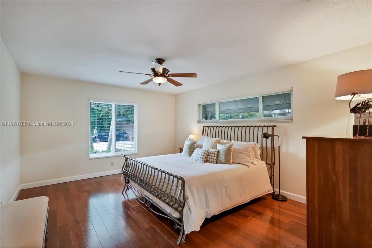 1525 Southwest 6th Avenue Boca Raton, FL 33486 - Photo 16 of 30 a bedroom with a bed and window