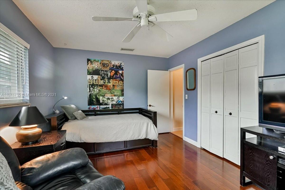 1525 Southwest 6th Avenue Boca Raton, FL 33486 - Photo 19 of 30 a living room with furniture and a flat screen tv