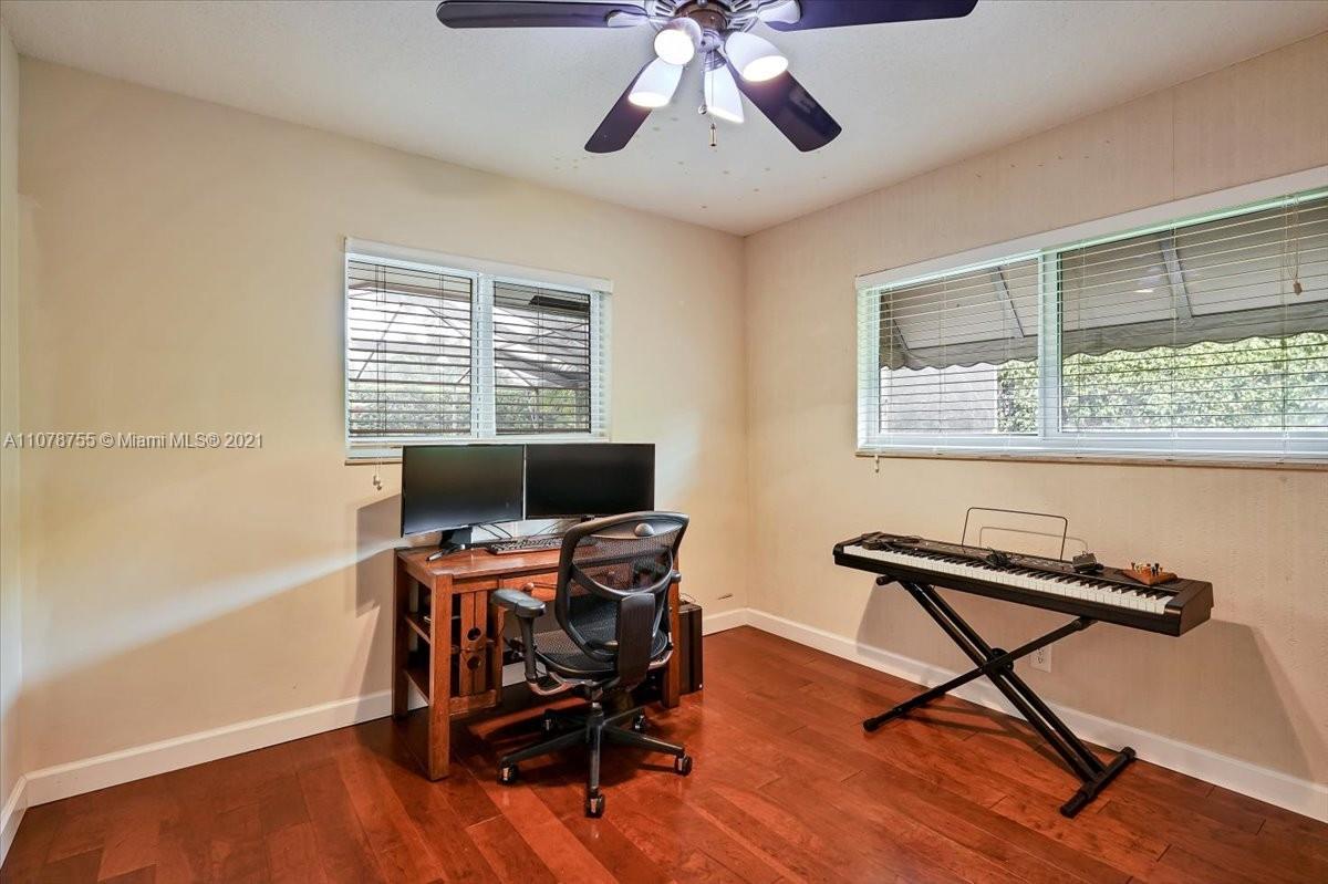 1525 Southwest 6th Avenue Boca Raton, FL 33486 - Photo 20 of 30 a view of a workspace with furniture and a window