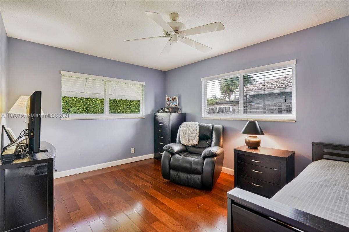 1525 Southwest 6th Avenue Boca Raton, FL 33486 - Photo 21 of 30 a bedroom with furniture and a window