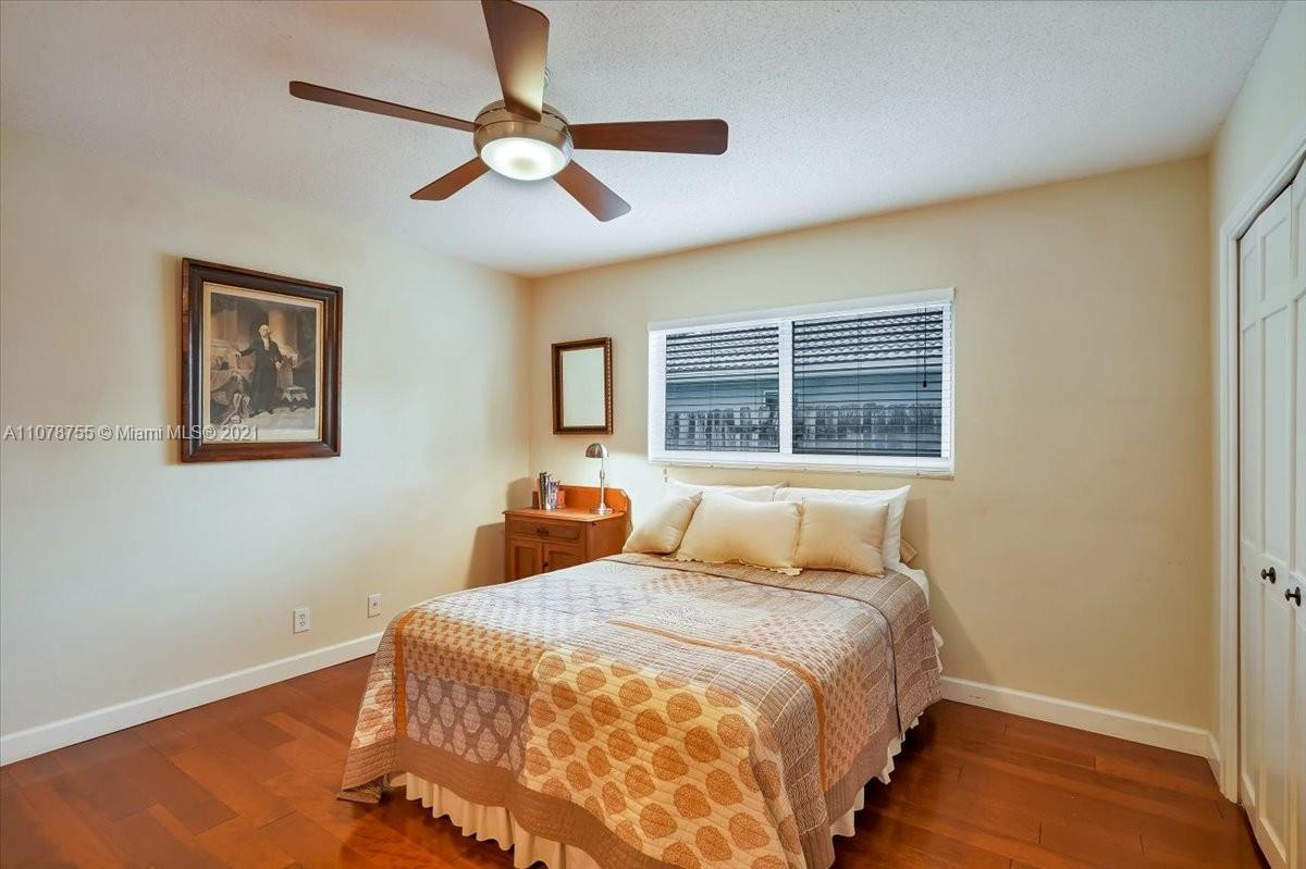 1525 Southwest 6th Avenue Boca Raton, FL 33486 - Photo 22 of 30 a bedroom with a bed and a window