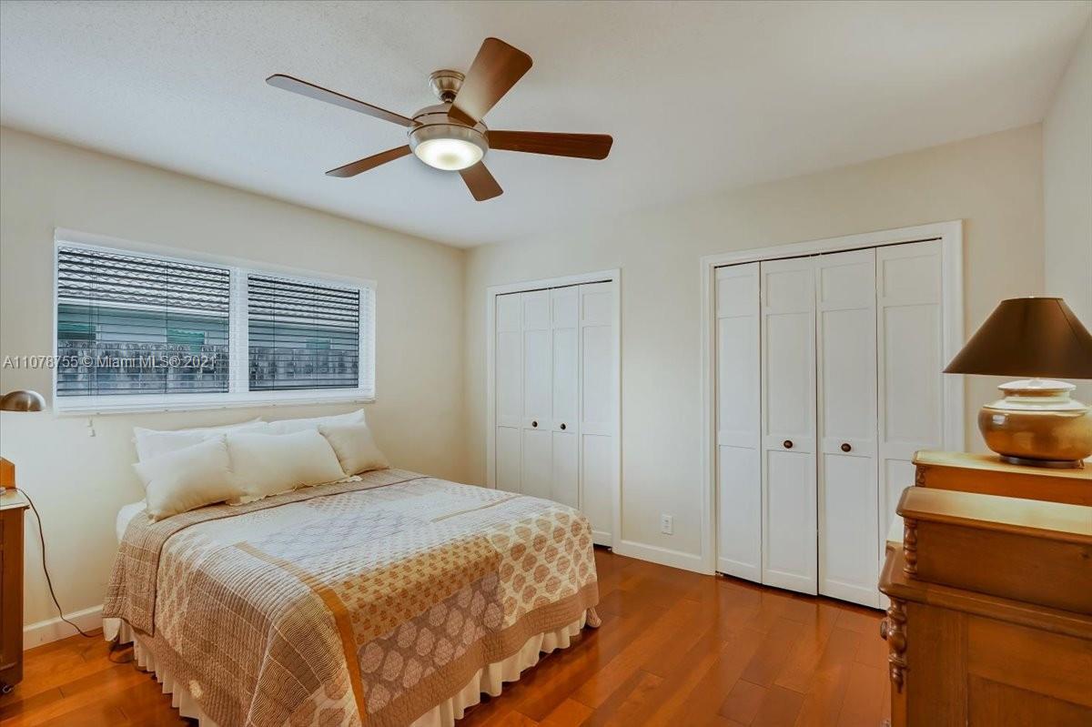 1525 Southwest 6th Avenue Boca Raton, FL 33486 - Photo 23 of 30 a bedroom with a bed and a window
