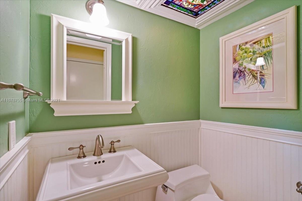 1525 Southwest 6th Avenue Boca Raton, FL 33486 - Photo 24 of 30 a bathroom with a sink and a mirror