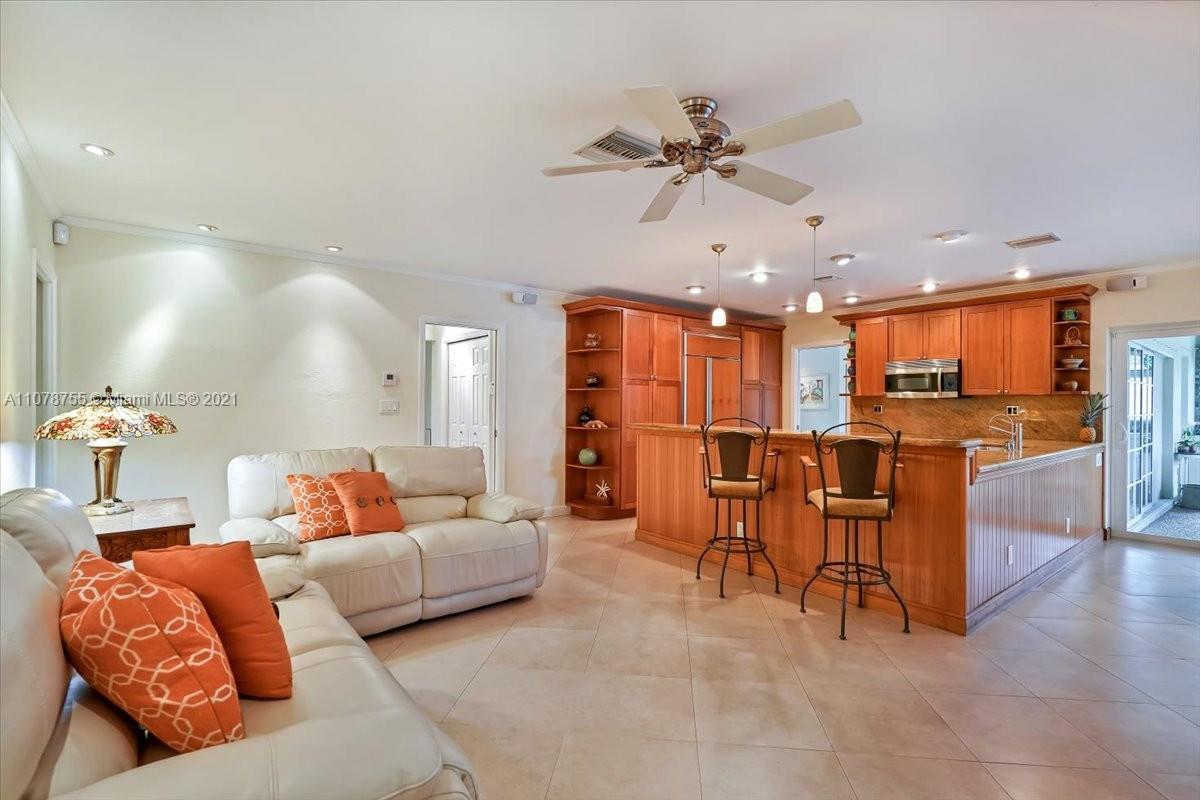 1525 Southwest 6th Avenue Boca Raton, FL 33486 - Photo 3 of 30 a living room with furniture and kitchen view