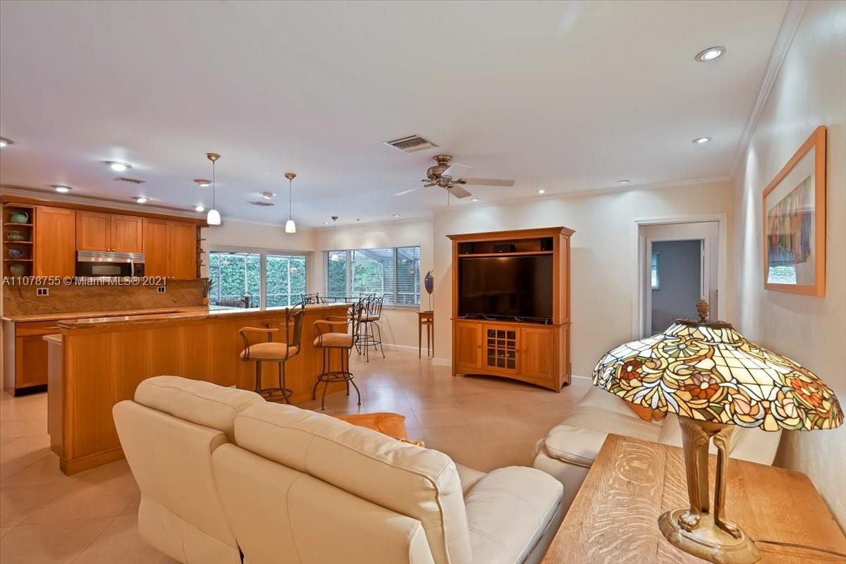 1525 Southwest 6th Avenue Boca Raton, FL 33486 - Photo 5 of 30 a living room with furniture and a flat screen tv