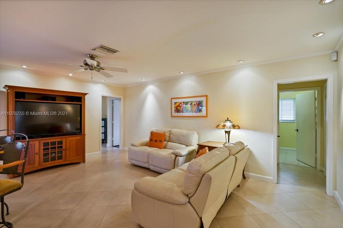 1525 Southwest 6th Avenue Boca Raton, FL 33486 - Photo 8 of 30 a living room with furniture and a flat screen tv