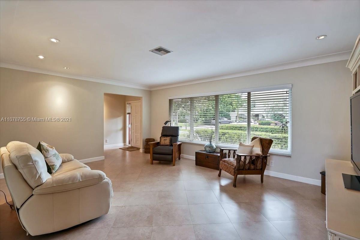 1525 Southwest 6th Avenue Boca Raton, FL 33486 - Photo 9 of 30 a living room with furniture and floor to ceiling window