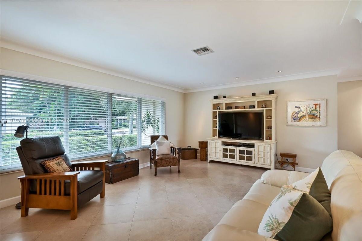1525 Southwest 6th Avenue Boca Raton, FL 33486 - Photo 10 of 30 a living room with furniture and a flat screen tv