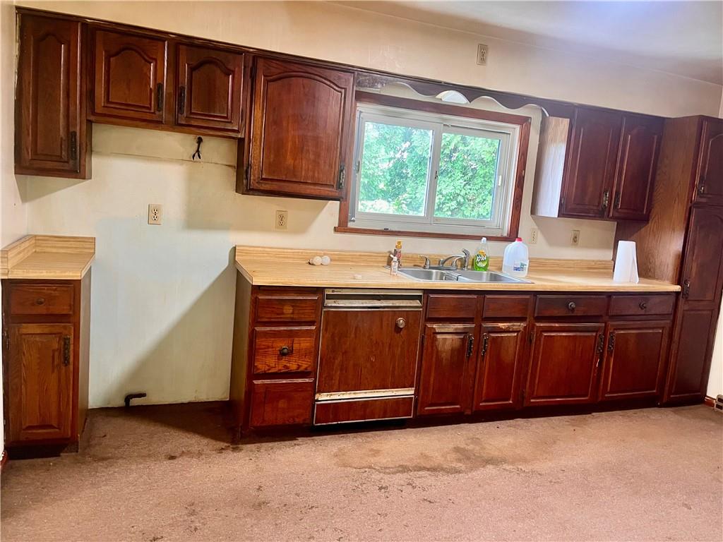 946 Herman Butler, PA 16002 - Photo 11 of 20 a kitchen with wooden cabinets and a sink