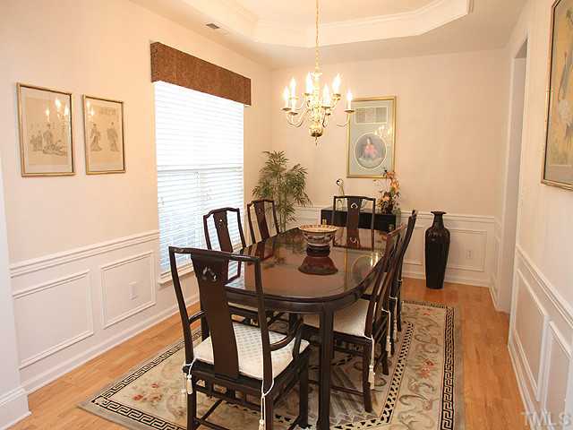 5510 Kirner Court Raleigh, NC 27613 - Photo 4 of 14 Beautiful separate dining room. Hardwood floors, trey ceiling, and wainscoting add to the beauty of the room. You get to give your guests the Royal Treatment!
