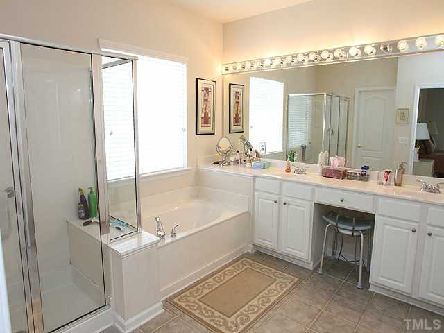 5510 Kirner Court Raleigh, NC 27613 - Photo 8 of 14 Master bath has separate shower and garden tub. Double vanities and great cabinetry and dressing top space.