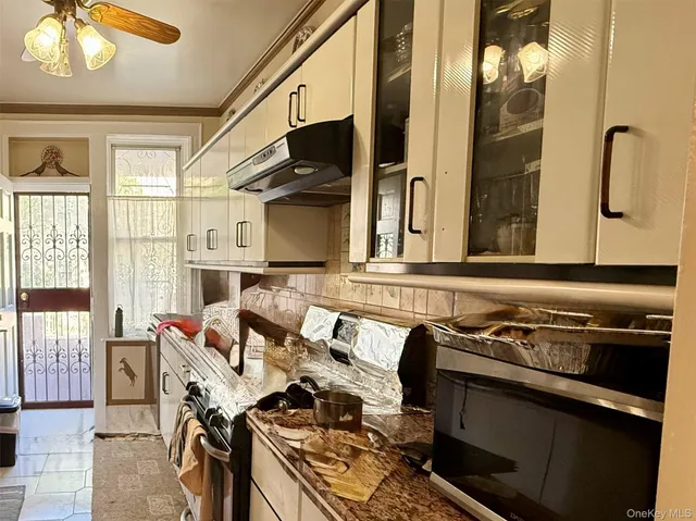 a kitchen with stainless steel appliances granite countertop a stove and a sink