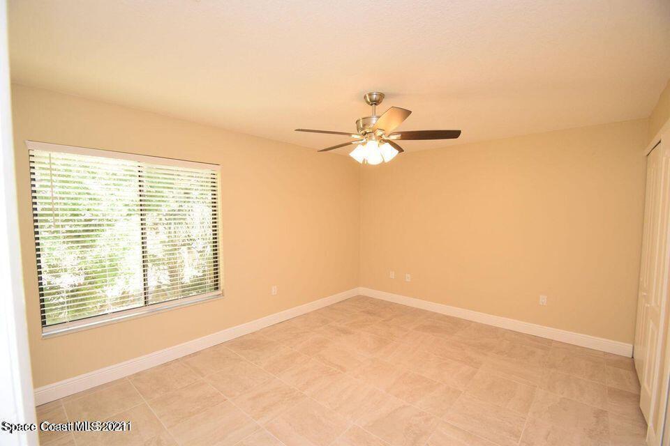 670 Cedar Side Circle Northeast Palm Bay, FL 32905 - Photo 20 of 22 a view of an empty room with a window
