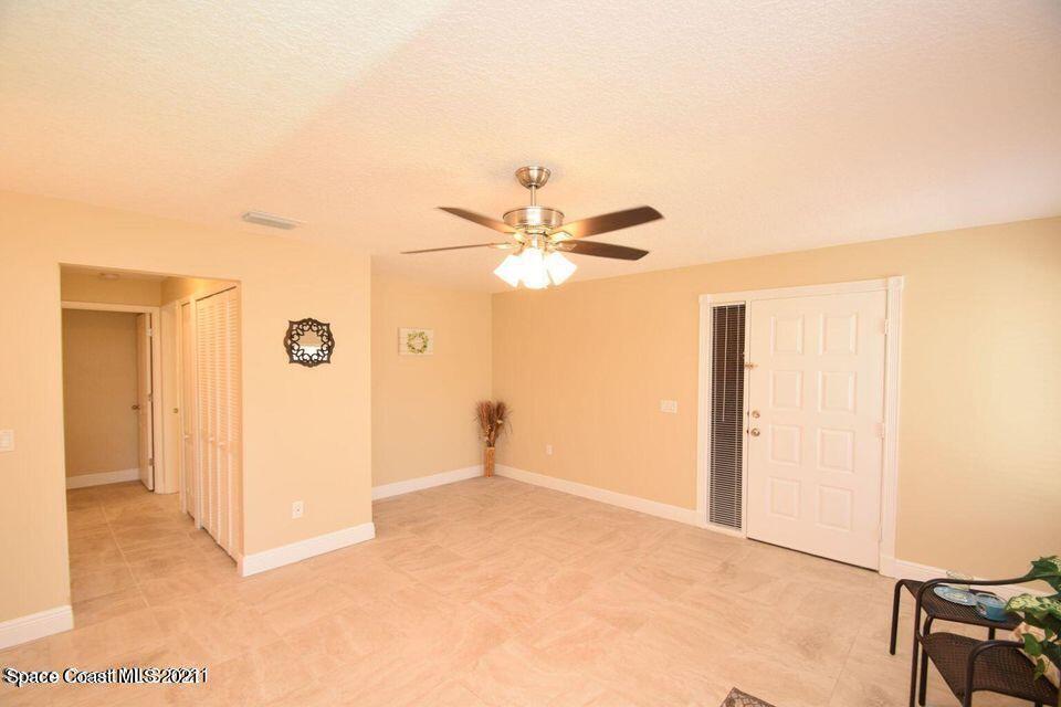 670 Cedar Side Circle Northeast Palm Bay, FL 32905 - Photo 4 of 22 a view of a room with a ceiling fan