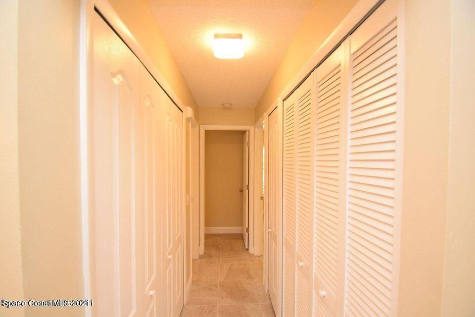 670 Cedar Side Circle Northeast Palm Bay, FL 32905 - Photo 6 of 22 a view of a closet area with sky view